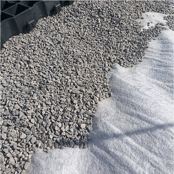 Tensile strong polyester nonwoven geotextile fabric road base