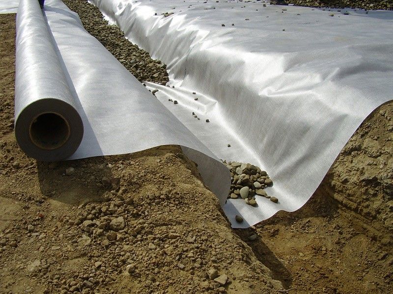 Non-woven geotextile fabric for soft soil layer reinforcement