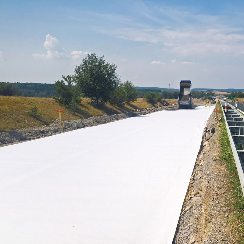 Tensile strong polyester nonwoven geotextile fabric road base